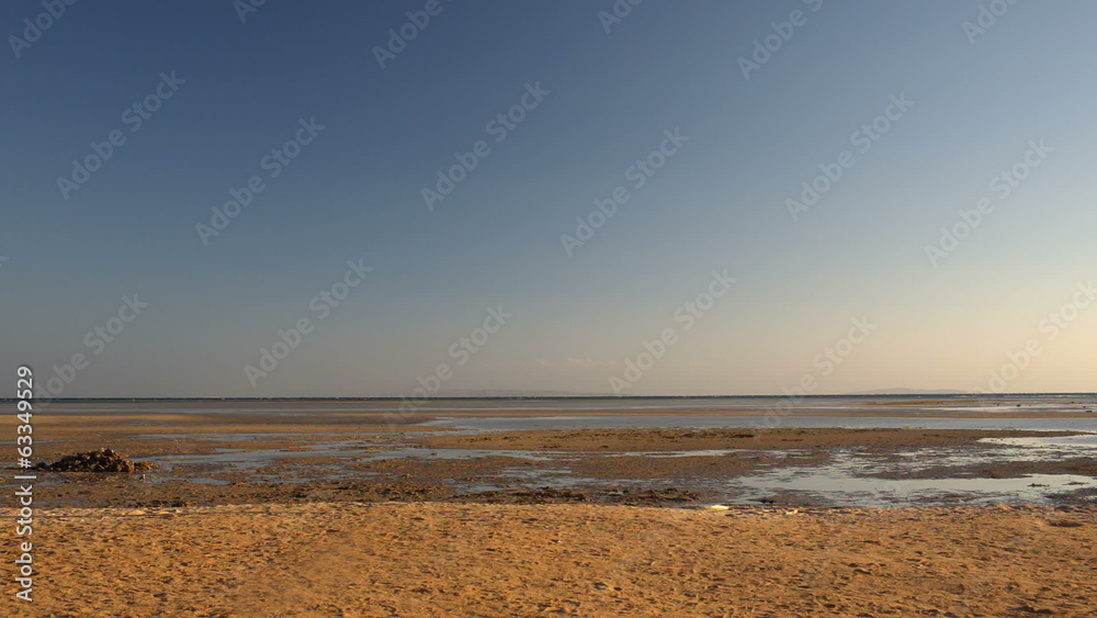 Excited man running on the beach Excited man running on the beach