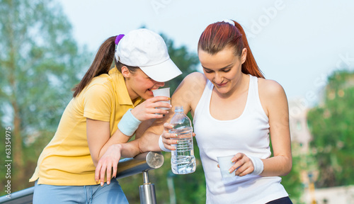 Friendship of two young girlfriends in healthy lifestyle