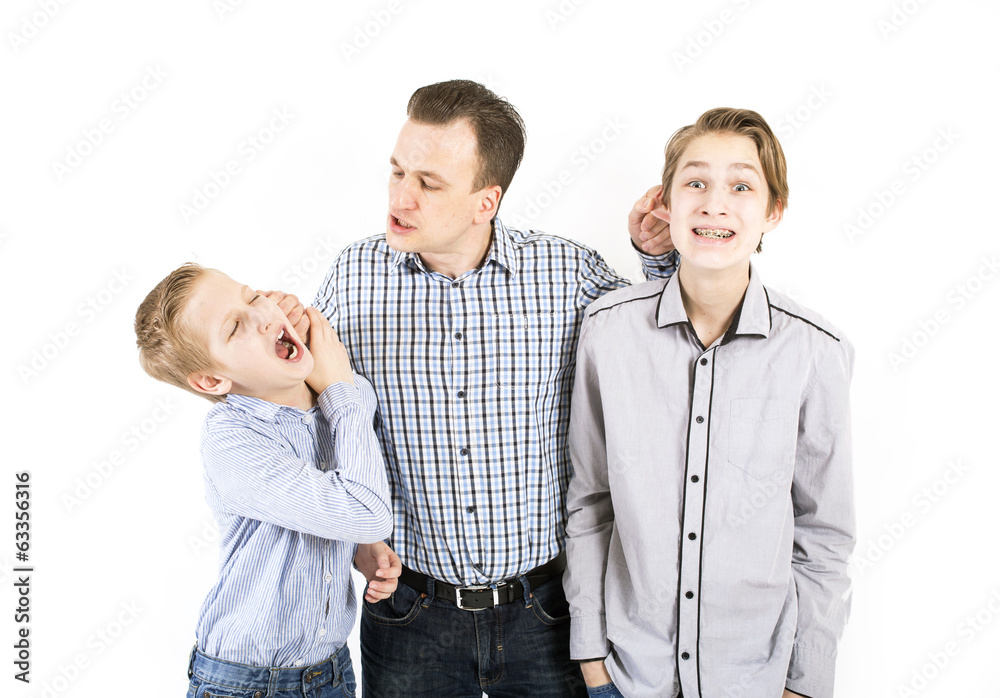 Strict father punishes his sons. Stock Photo | Adobe Stock