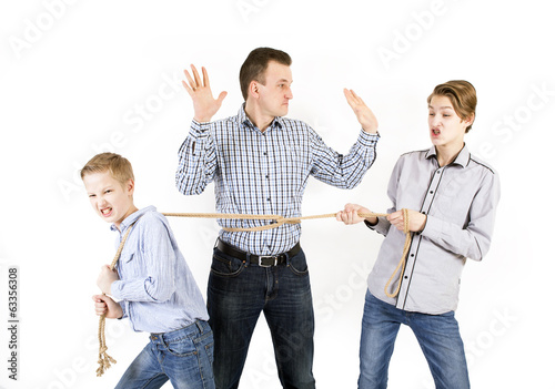 Father and two sons connected by rope photo