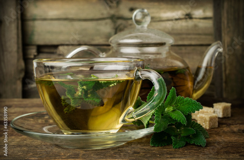 mint tea in glass teapot and cup