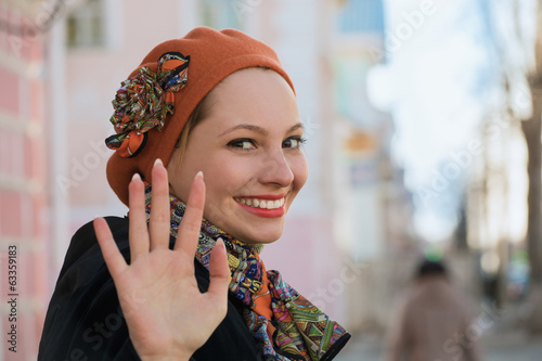 The girl says goodbye in the street