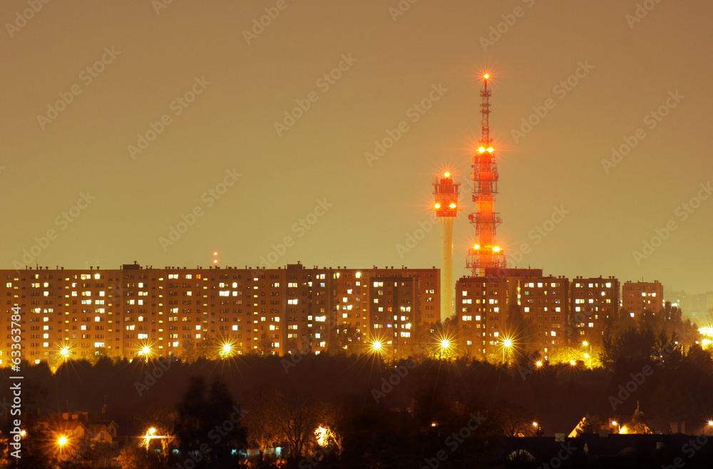 Fototapeta premium Blocks of flats and television tower at night in Poznan .