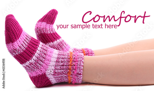 Female legs in colorful socks, isolated on white