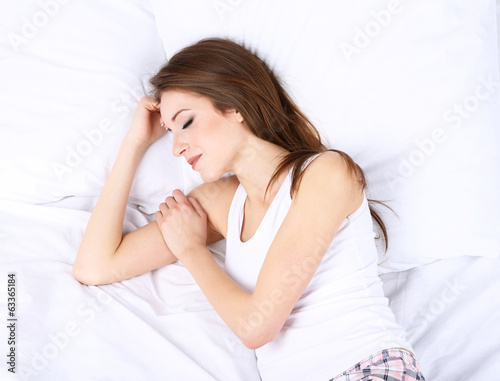 Young beautiful woman sleeping in bed close-up