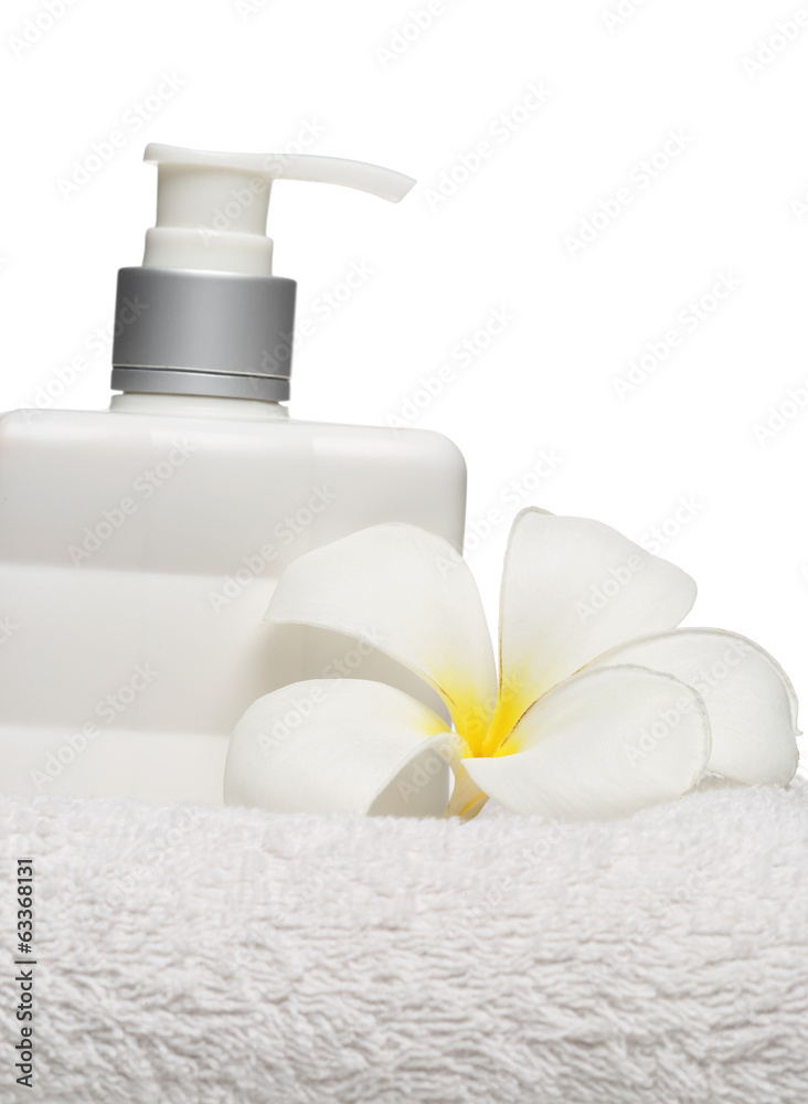 square bottle soap and flower on white towel white background square bottle soap and flower on white towel white background