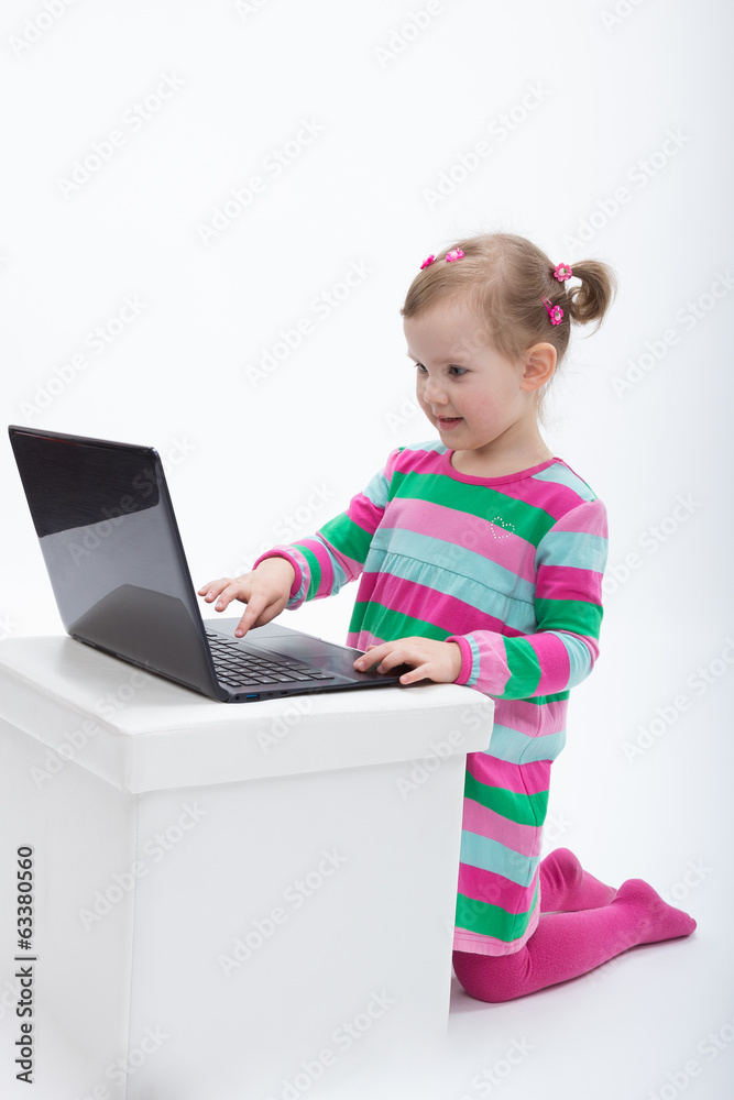 Little girl using laptop computer