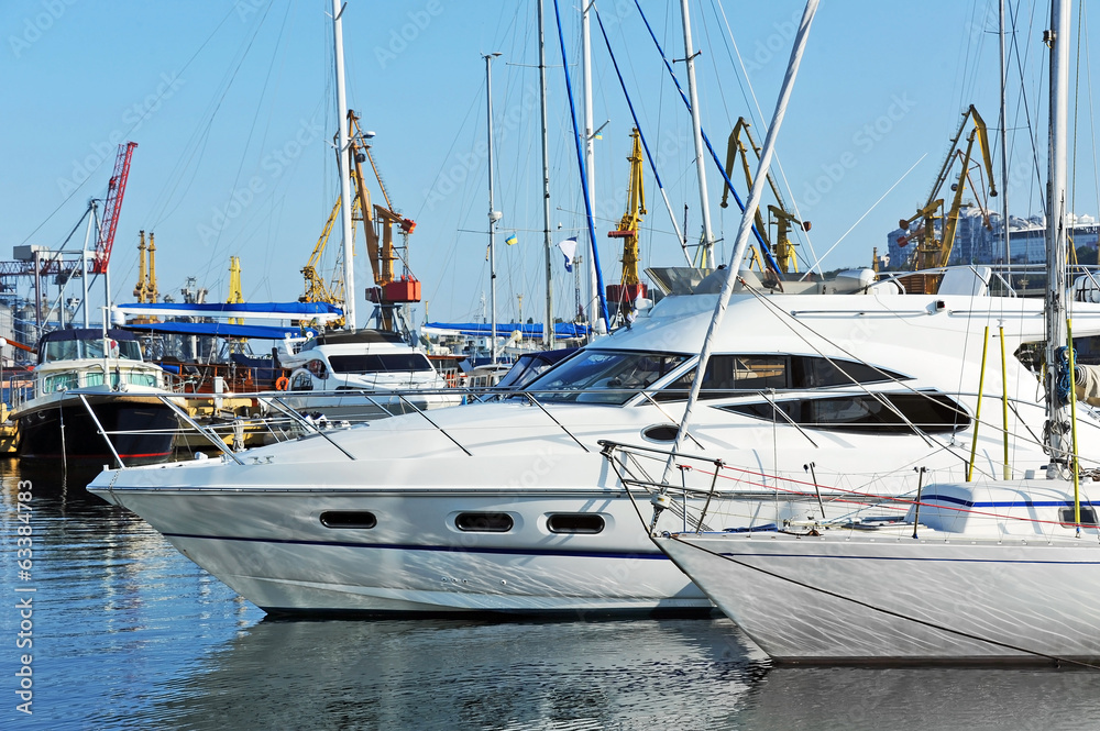 White motor yacht over harbor pier, Odessa, Ukraine