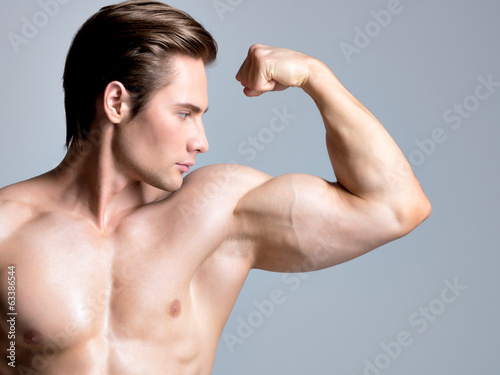 Handsome man with sexy muscular beautiful body.