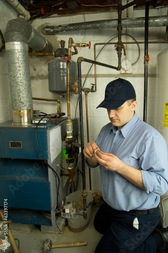 Service technician repairs heat