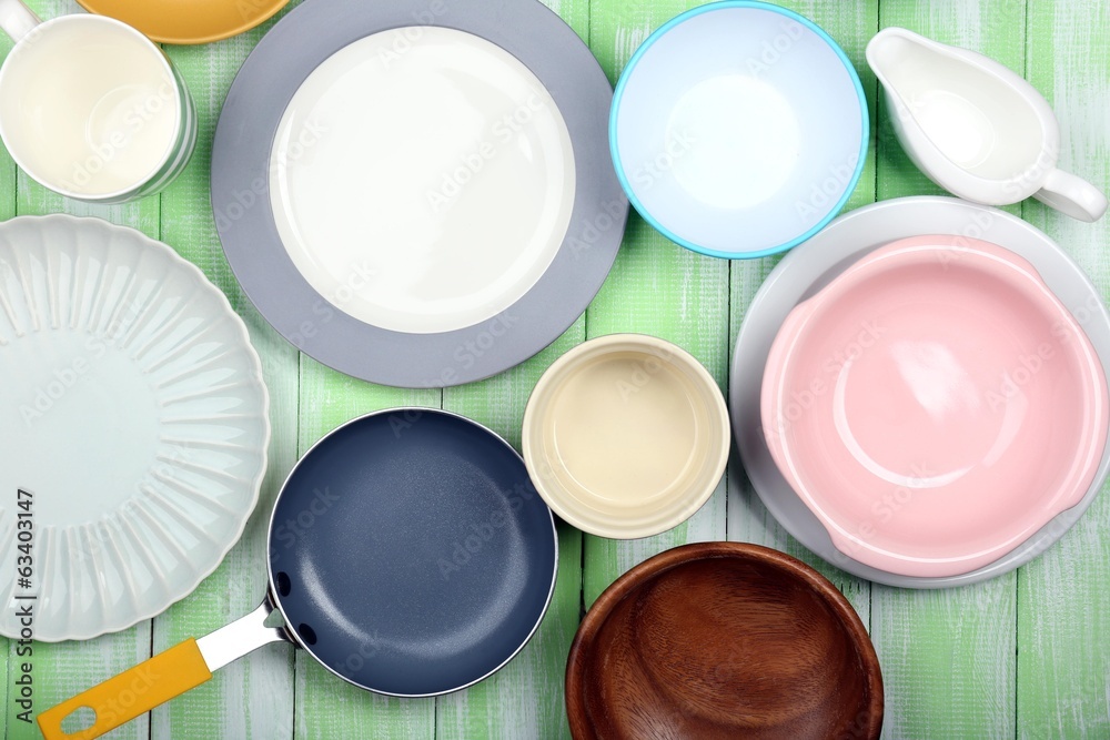 Different tableware on wooden background Different tableware on wooden background