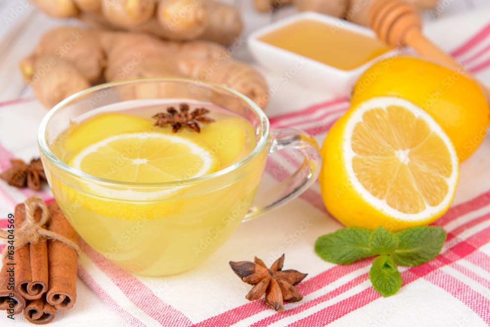 Healthy ginger tea with lemon and honey on table close-up Healthy ginger tea with lemon and honey on table close-up
