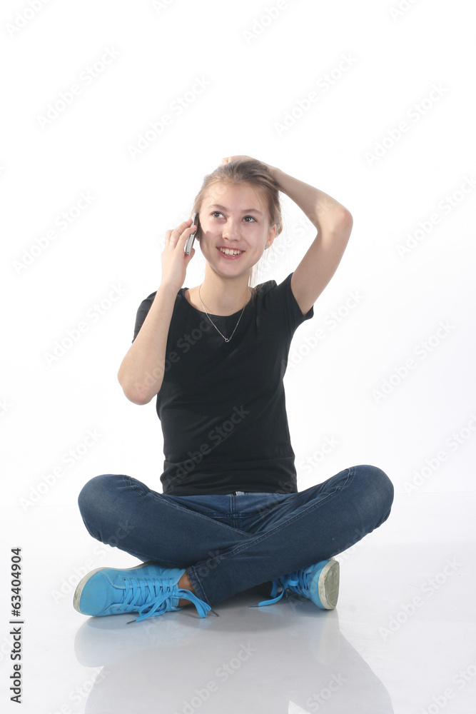 beautiful girl in the studio talking on the phone