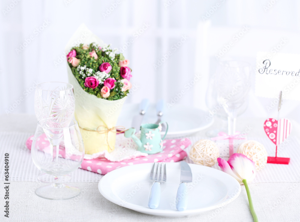 Beautiful spring table setting on light background