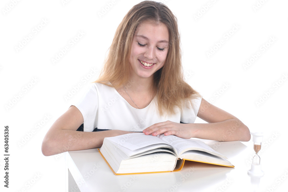 Schoolgirl reading on a white background Schoolgirl reading on a white background