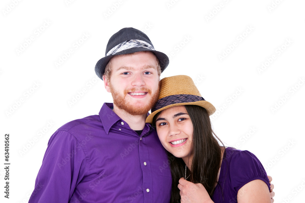 Fototapeta premium Happy young interracial couple in purple shirts, studio shot