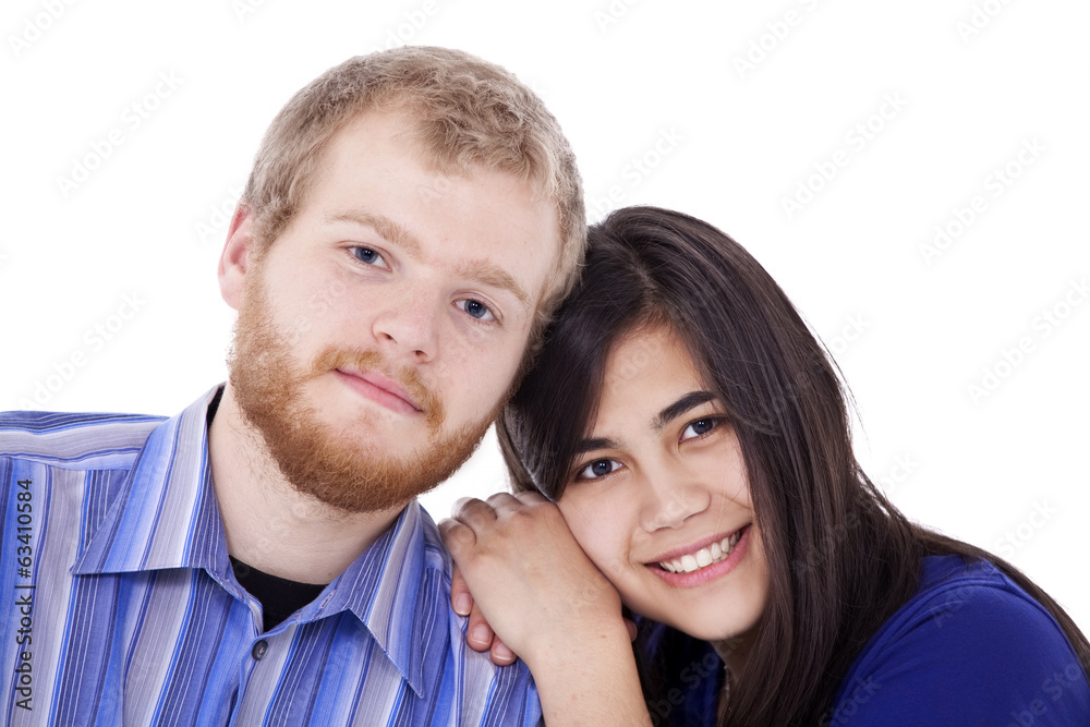 Happy young interracial couple in blue, early twenties or late t