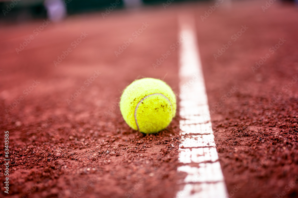 close-up of tennis ball on the clay court