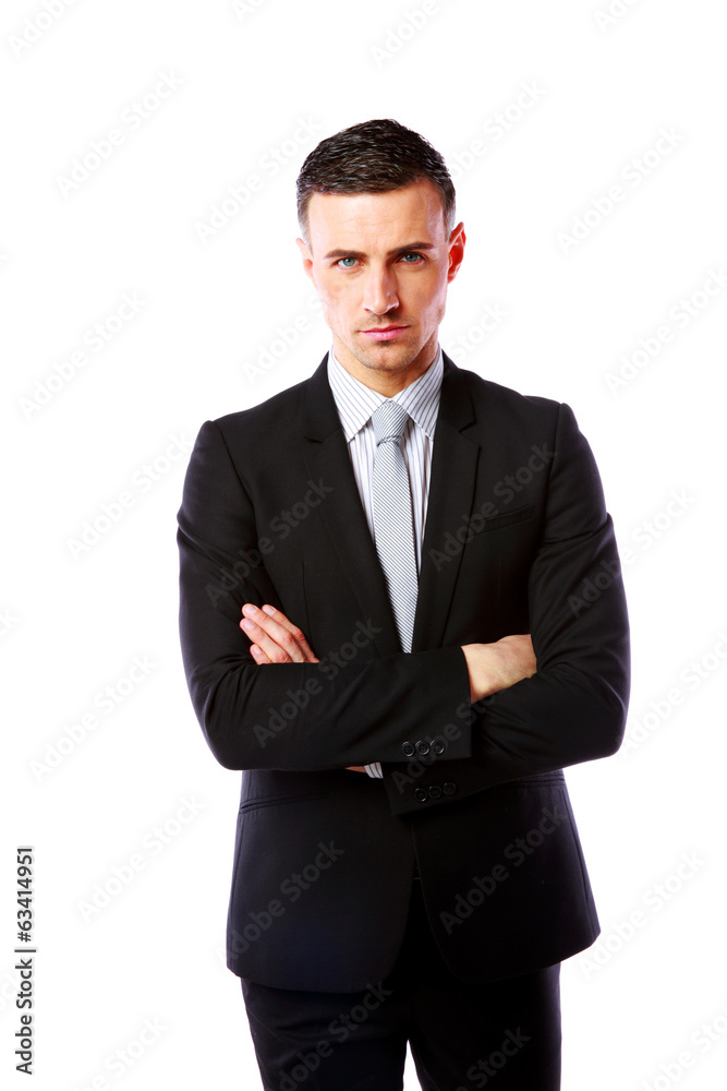 Handsome businessman standing with arms folded Handsome businessman standing with arms folded