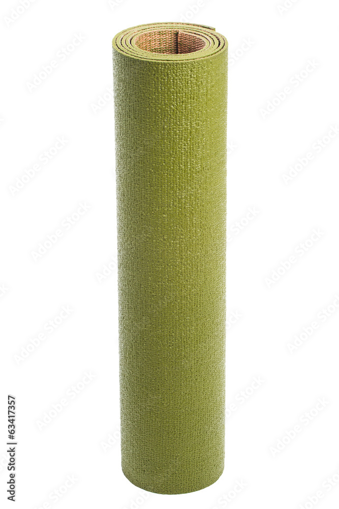 Yoga mat isolated on a white background. Green gymnastic mat. Yoga mat isolated on a white background. Green gymnastic mat.