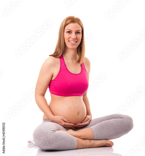 Adorable mother touching her stomach