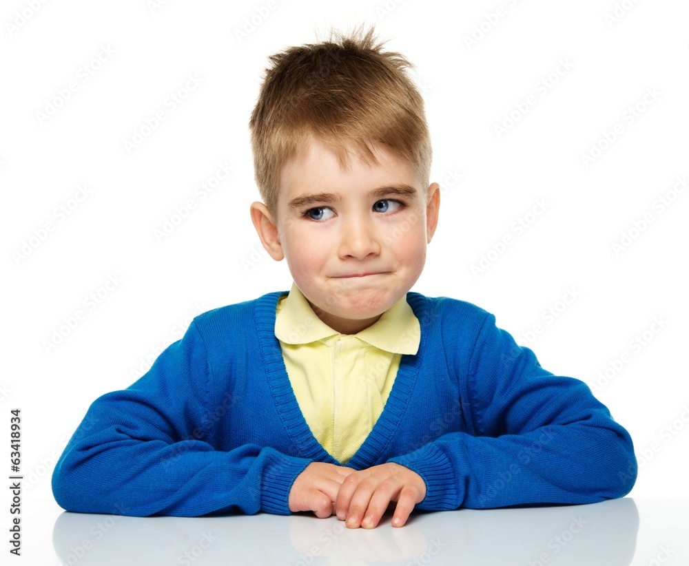 Cheerful little boy in blue cardigan and yellow shirt Cheerful little boy in blue cardigan and yellow shirt