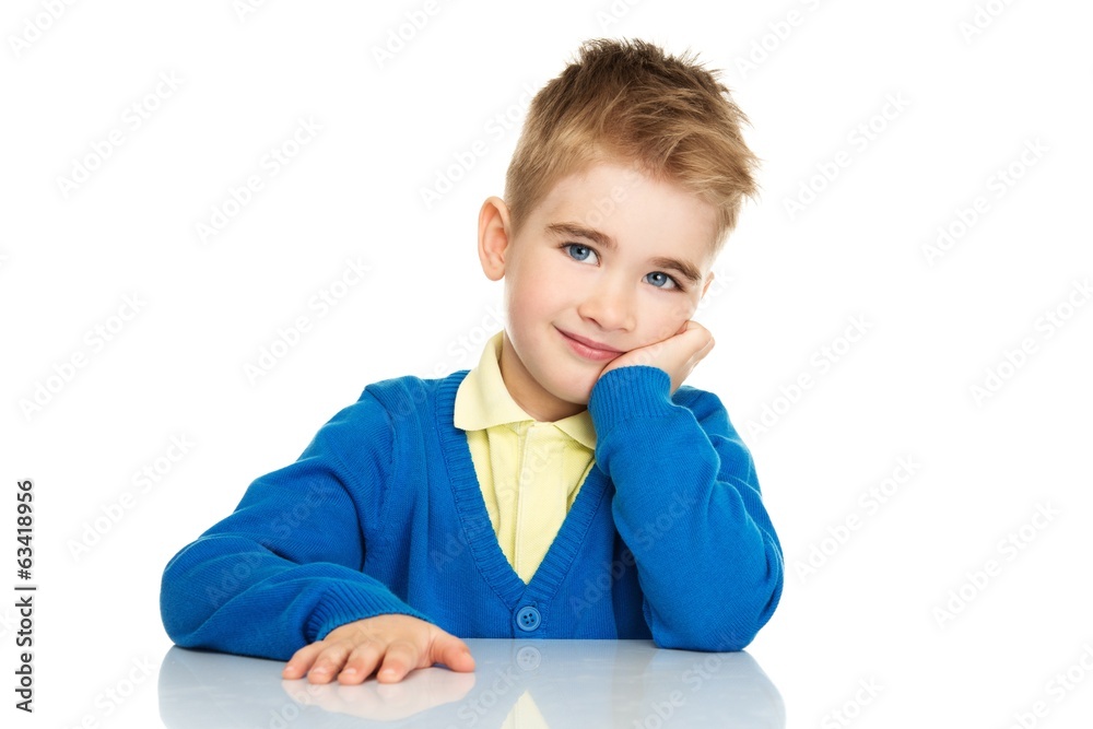 Cheerful little boy in blue cardigan and yellow shirt Cheerful little boy in blue cardigan and yellow shirt