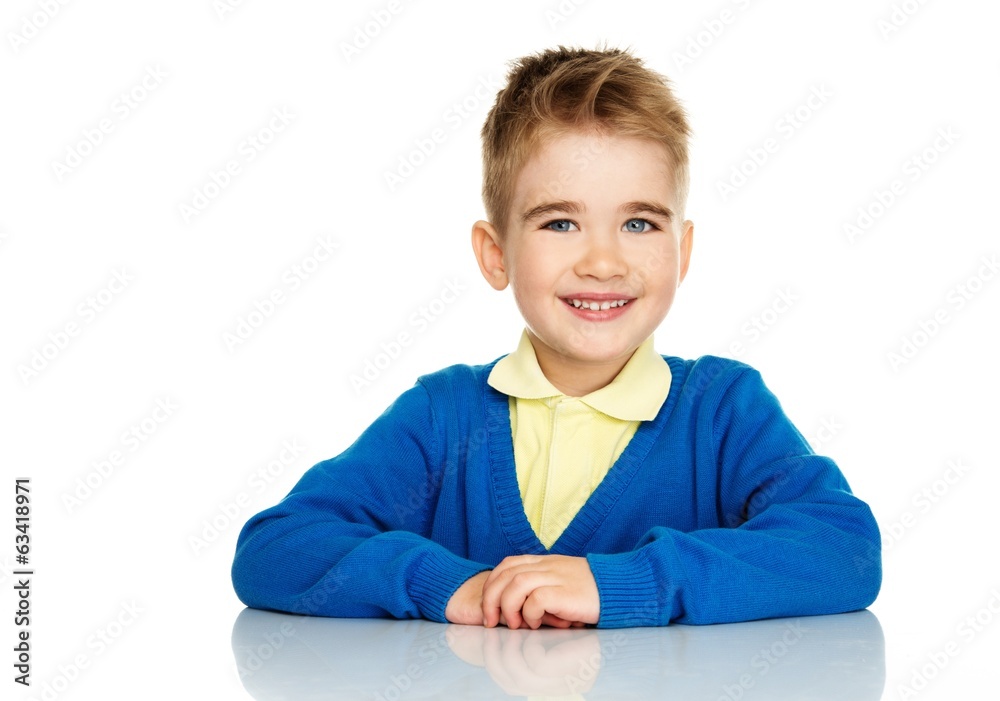 Cheerful little boy in blue cardigan and yellow shirt Cheerful little boy in blue cardigan and yellow shirt