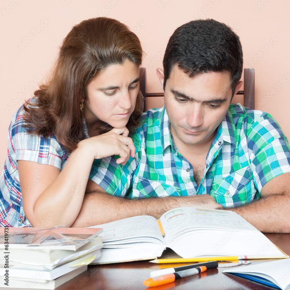 Hispanic  couple studying at home