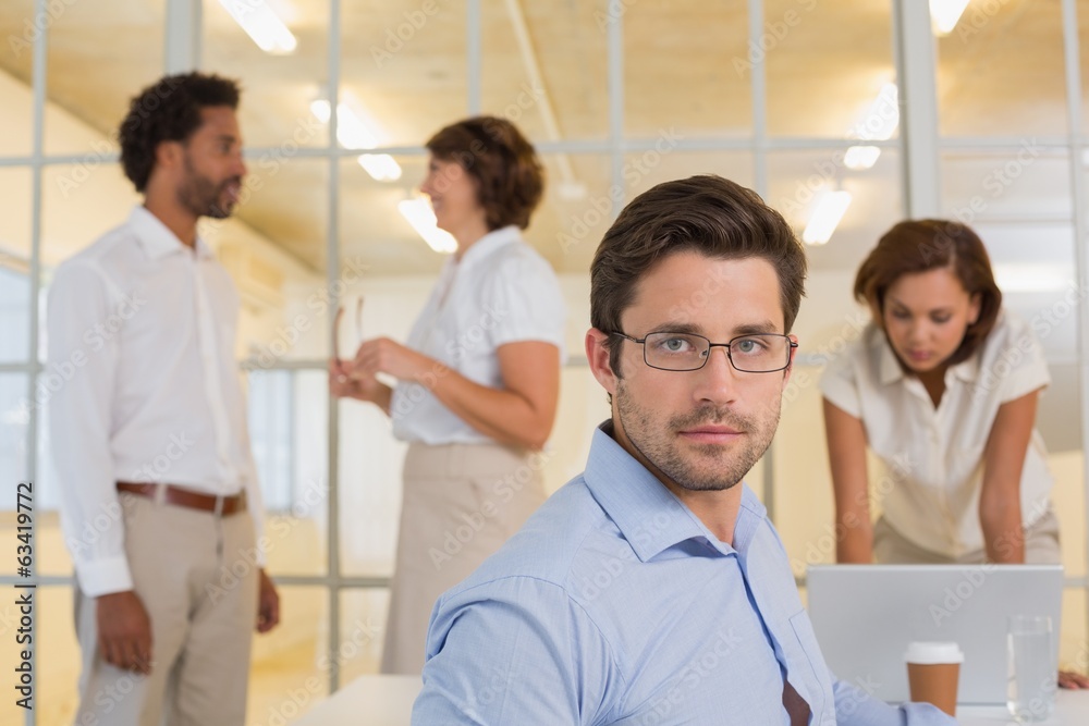 Serious businessman with colleagues in meeting Serious businessman with colleagues in meeting