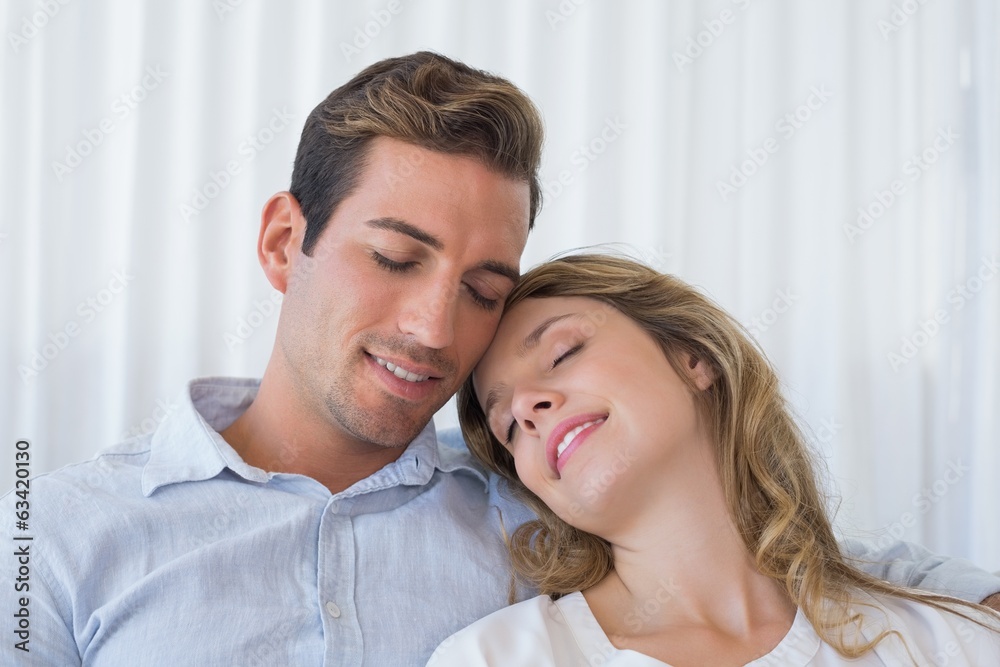 Close-up of a loving young couple with eyes closed