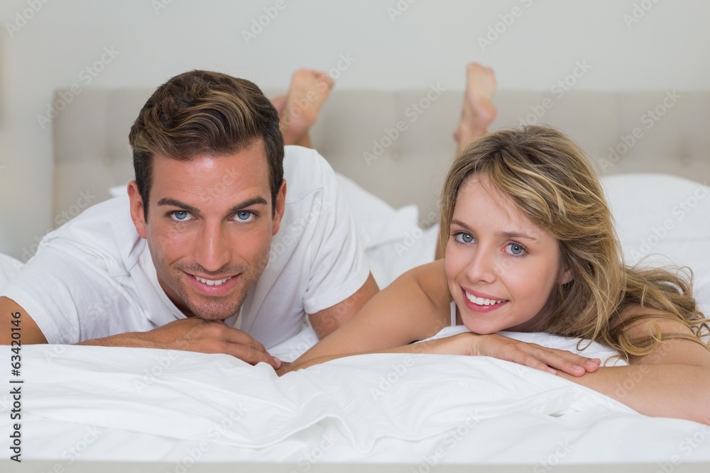 Close-up portrait of a loving couple lying in bed Close-up portrait of a loving couple lying in bed