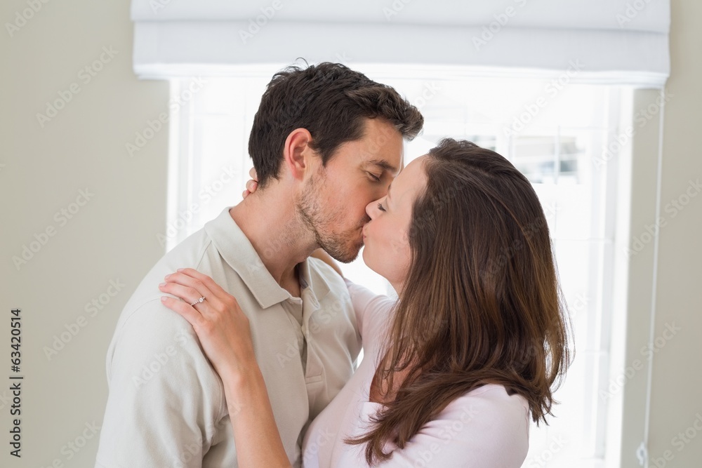 Side view of a loving couple kissing