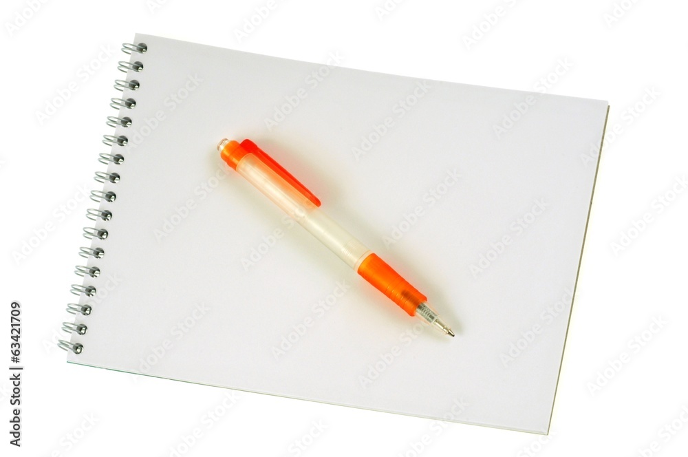 Le stylo sur le bloc-notes Le stylo sur le bloc-notes