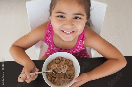 Close-up portrait of a girl having breakfast