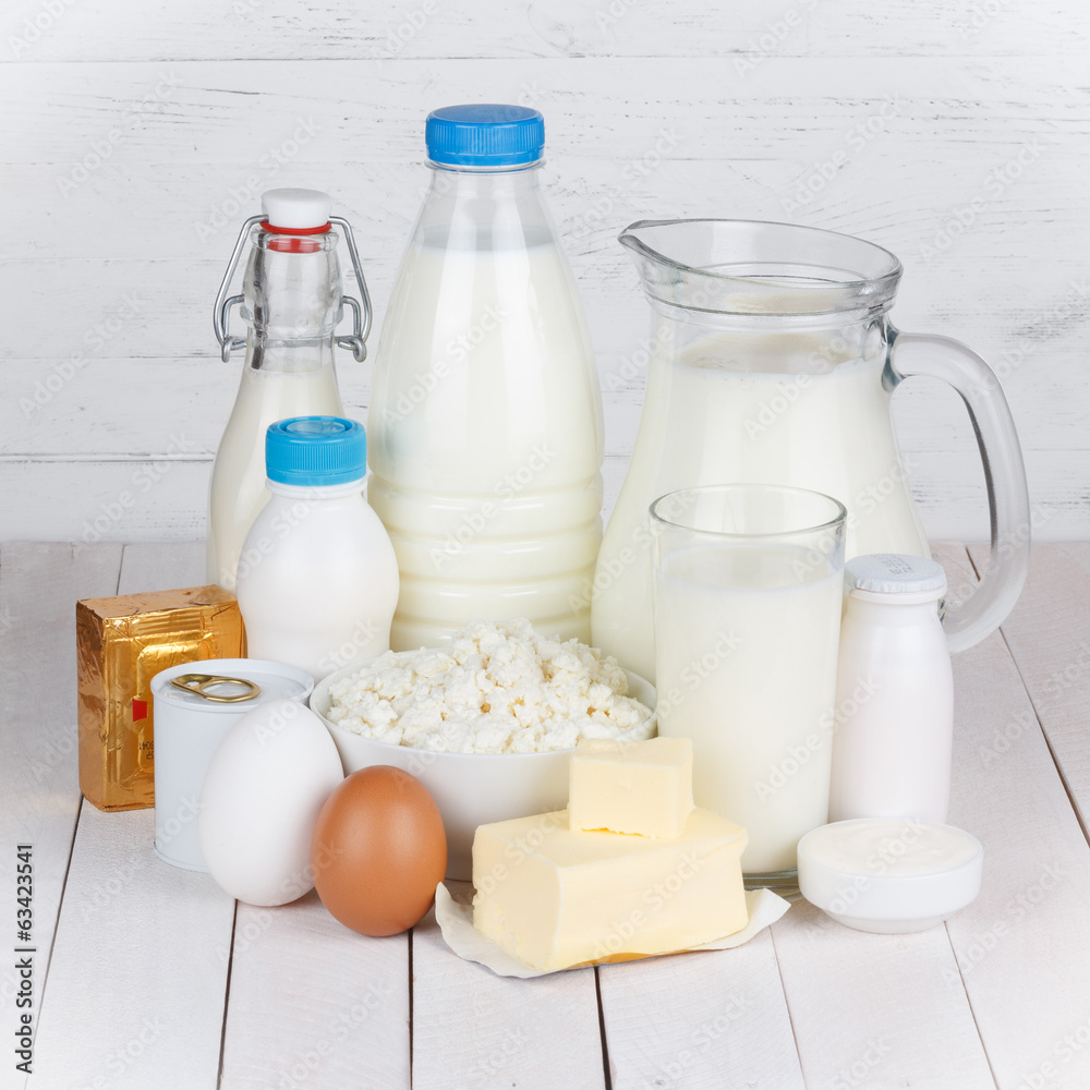 Dairy products on white wooden table still life Dairy products on white wooden table still life