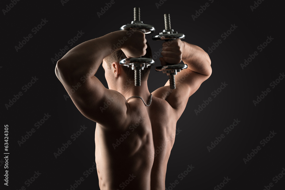 Naklejka premium bodybuilder doing exercises with dumbbells