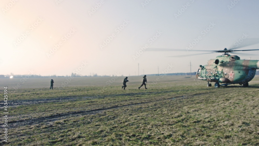Soldiers getting into the helicopter.