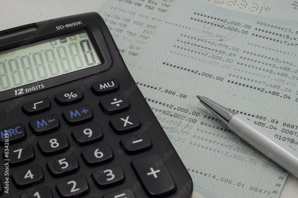 Account book, calculator and pen Account book, calculator and pen