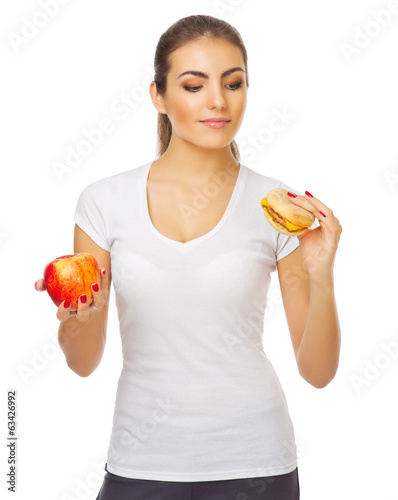 Young girl with apple and hamburger