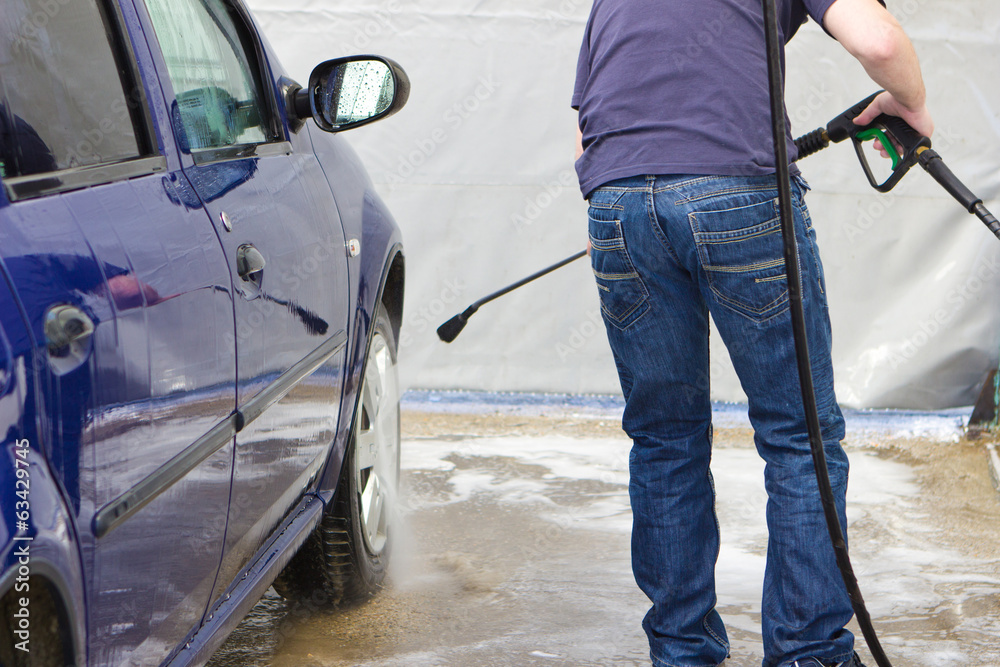 Man washing his car at self-service station Man washing his car at self-service station
