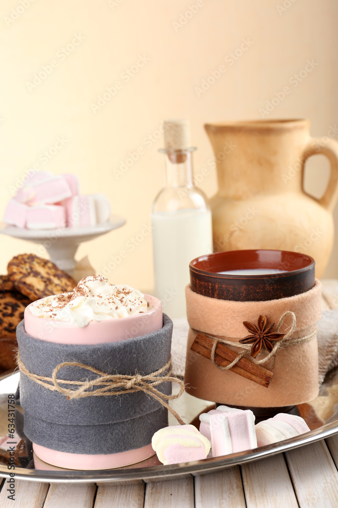 Mug of hot drink decorated in felt on wooden table Mug of hot drink decorated in felt on wooden table