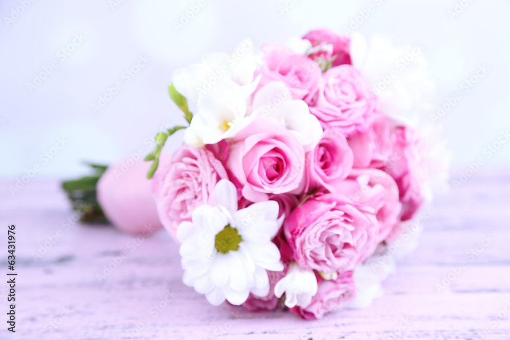 Beautiful wedding bouquet on table on bright background Beautiful wedding bouquet on table on bright background