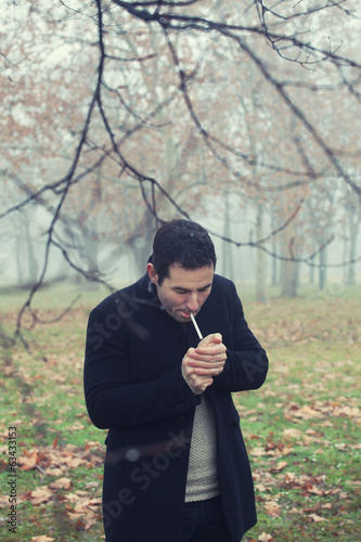 Man light a cigarette