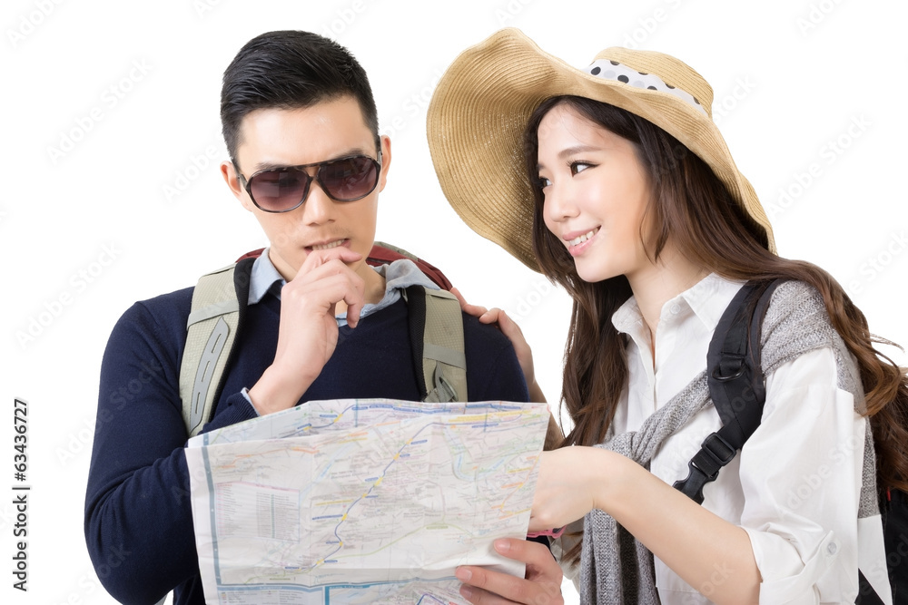 Asian young couple traveling and looking the map Asian young couple traveling and looking the map