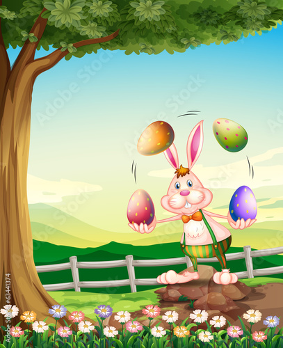 A rabbit juggling the Easter eggs