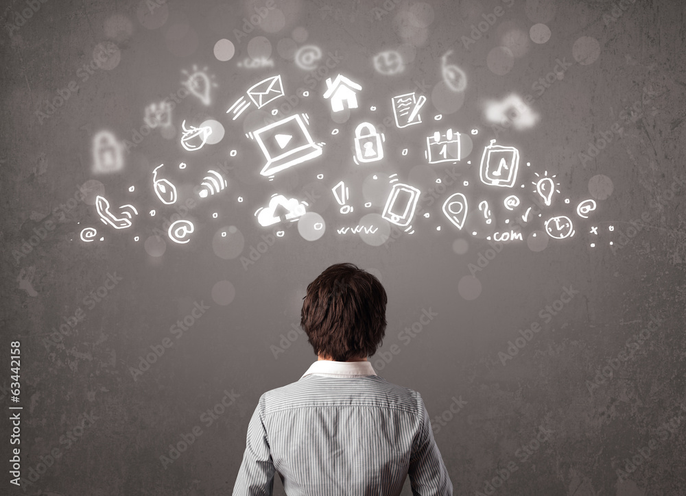 Business man looking at modern icons and symbols