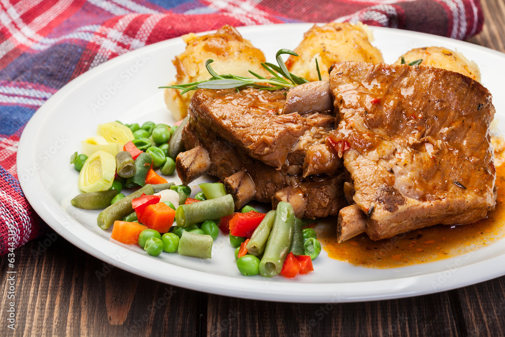 Pork spareribs served with mashed potatoes