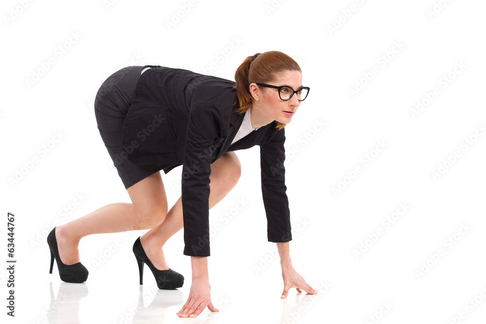Businesswoman on all fours on the starting line. Businesswoman on all fours on the starting line.