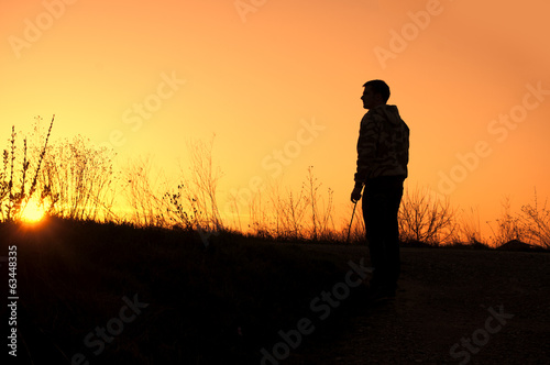 Silhouette of a young man